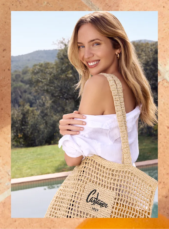 Model with raffia bag made by spanish brand Castañer for Natura Bissé