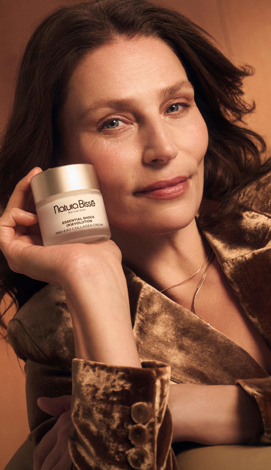 Woman posing with Essential Shock products, representing menopause-focused skincare