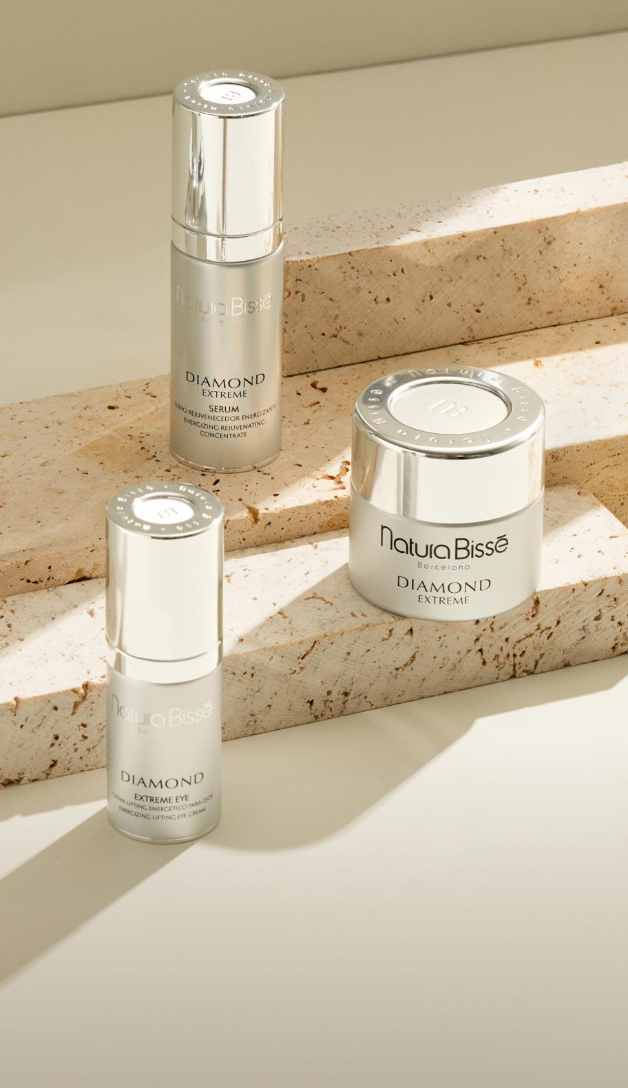 Model holding a Diamond Extreme product, representing age-defying skincare essentials