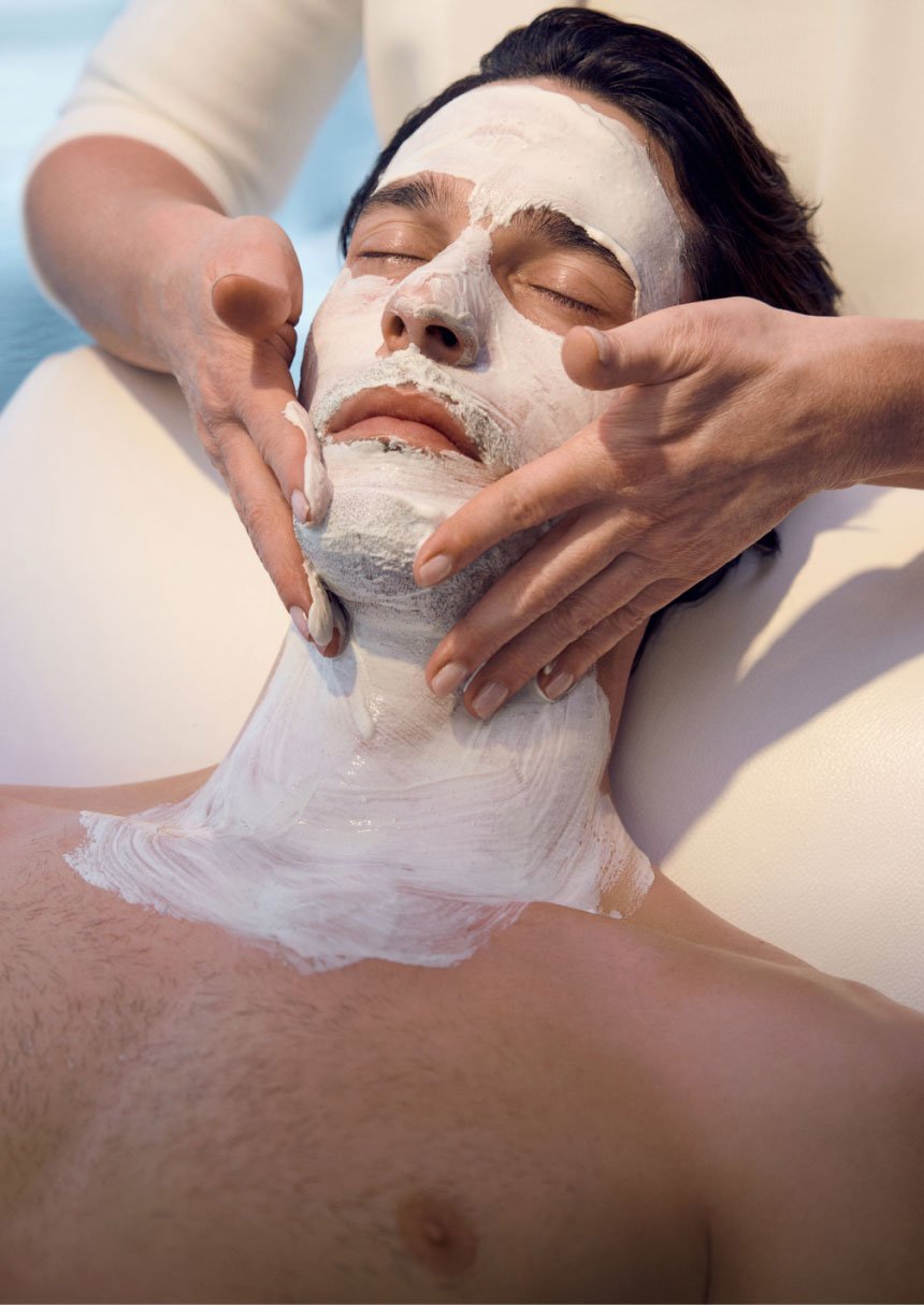 Man with clay face mask