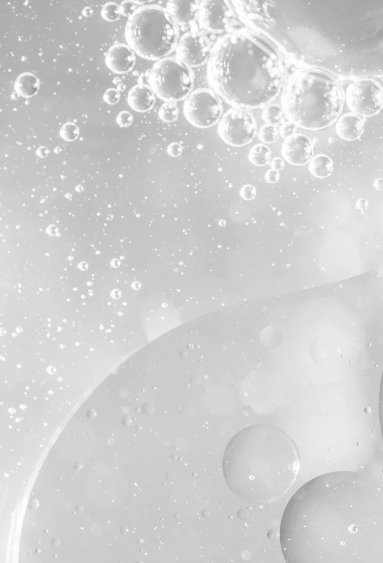 Close-up of a skincare formula with translucent bubbles.