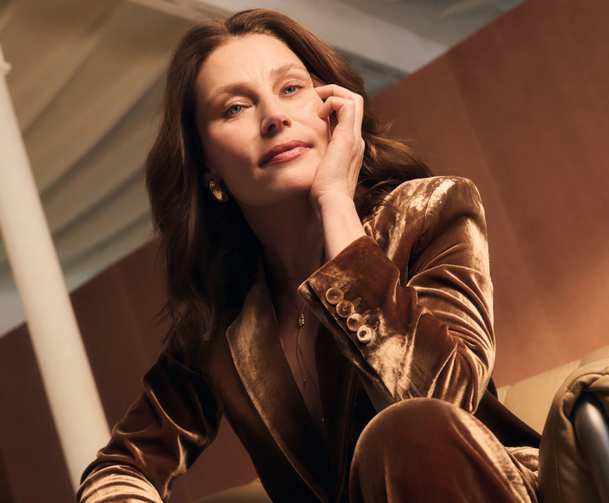 menopausal woman wearing ocre velvet suit