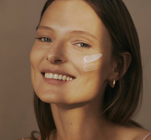 Model with hydrating creams applied to skin