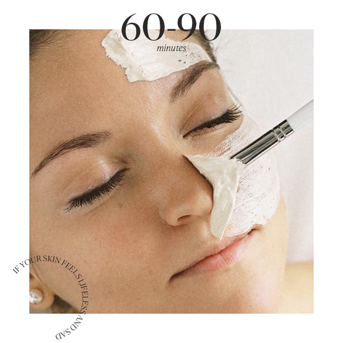 Clay mask being applied with a brush on a woman's face. The photo also has two texts, the first one reads 60-90 minutes, the second one says If your skin feels lifeless and sad