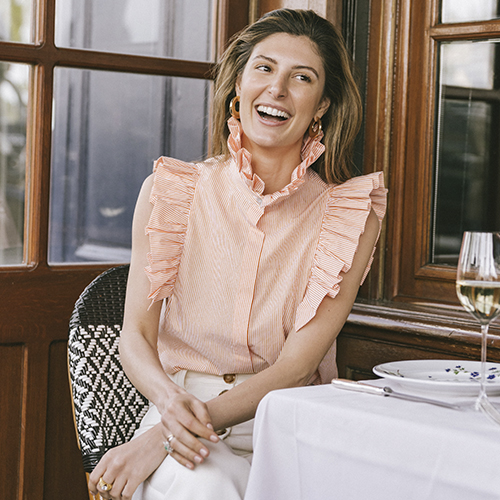 Maria de la Orden wearing the Vitamin Chic Blouse in orange