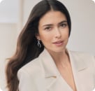 Smiling brunette woman with white blazer